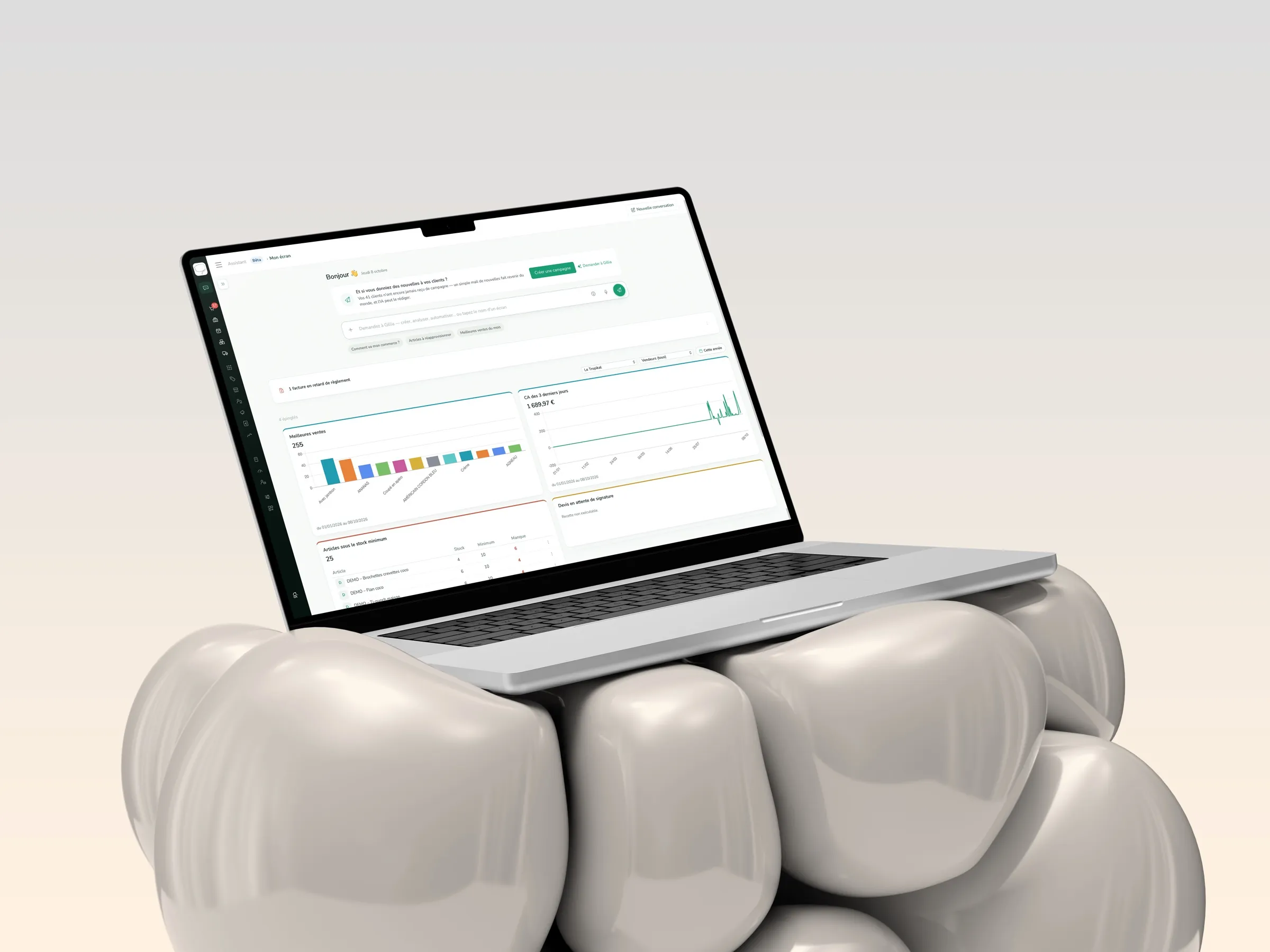 A laptop showing the Gillia dashboard with pinned indicators: best sellers, revenue over the last 3 days, and items below minimum stock.